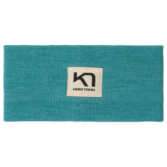 Teal headband with a Kari Traa logo on the front on a white background