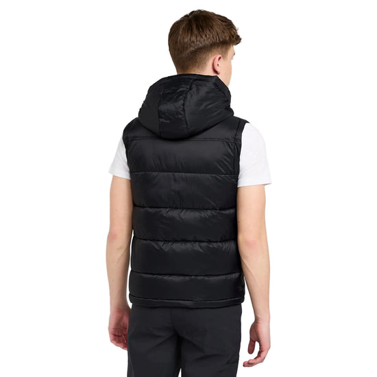 Person wearing a black puffer vest on a white background