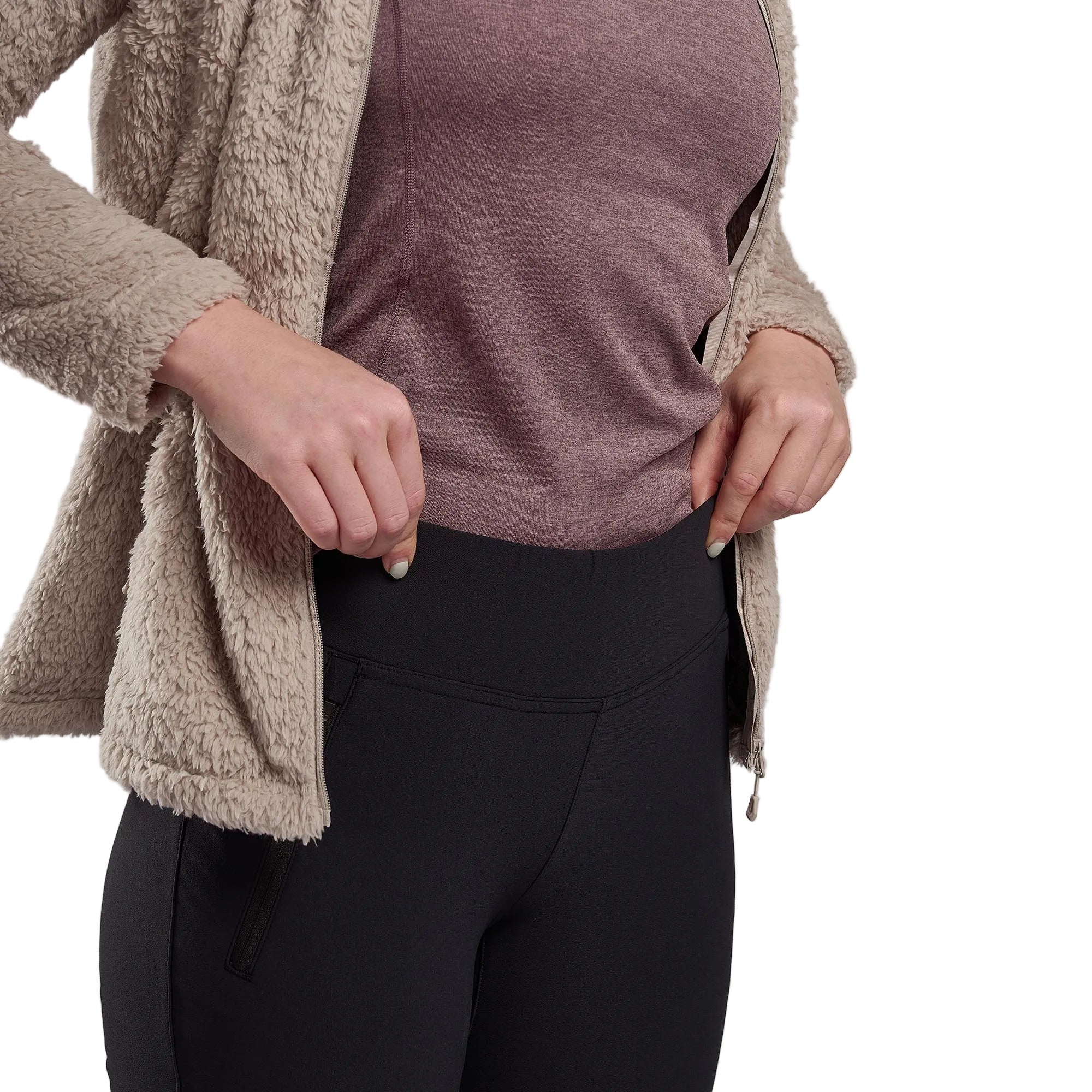 Person wearing a brown fleece jacket, purple shirt, and black pants on a gray background