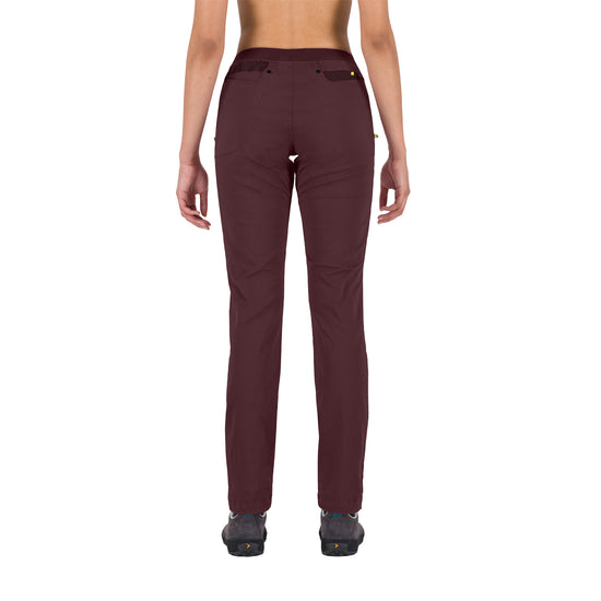 Maroon pants worn by a person on a white background