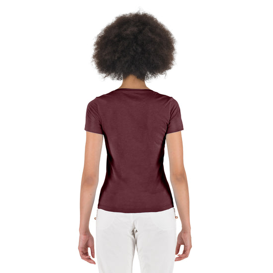 Person wearing a burgundy t-shirt on a white background