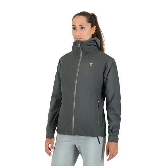 Woman wearing a grey jacket on a white background