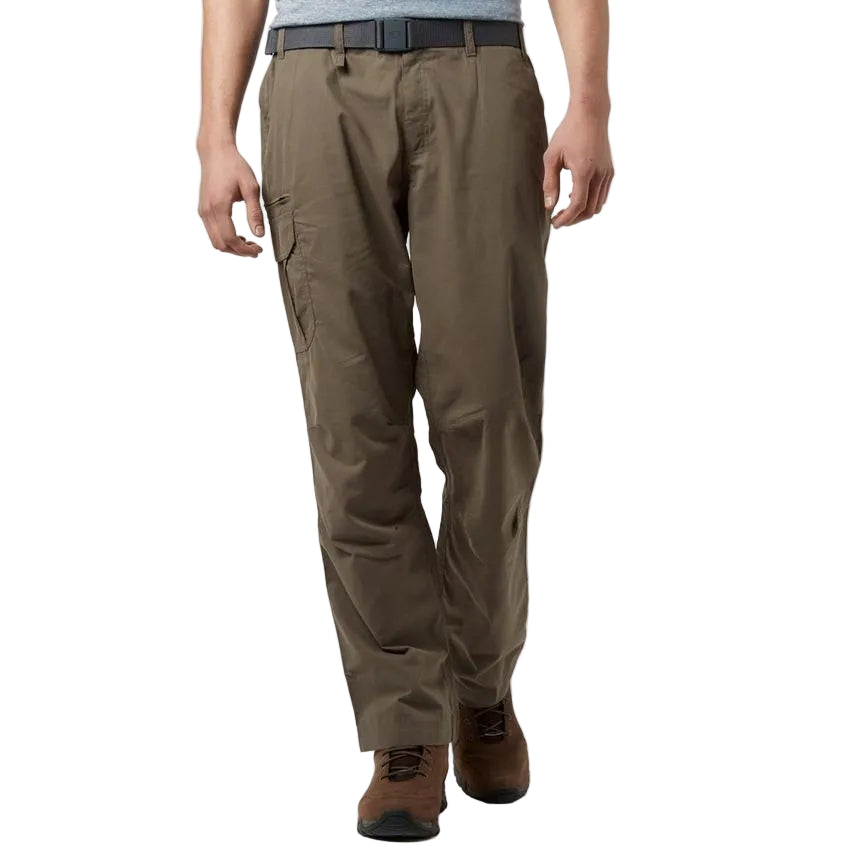 A man wearing brown walking trousers