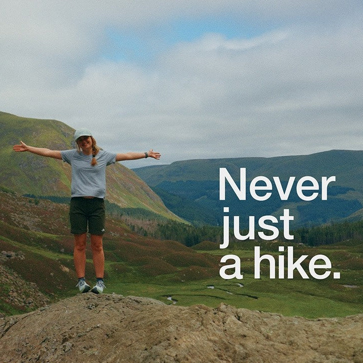 Hikers in the Scottish Highlands wearing The North Face gear, against a dramatic mountain backdrop for the Tiso Outdoors "Never Just a Hike" campaign.