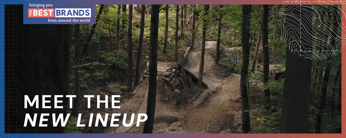 Forest bike‑park trail with dirt jumps and wooden ramps promoting top global outdoor brands and introducing the new product lineup.