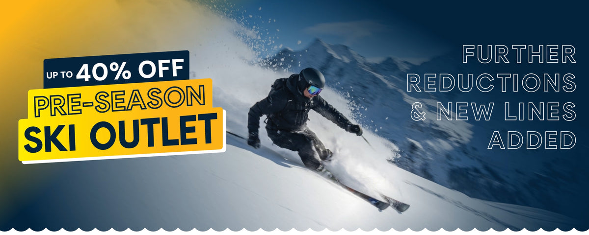 Skier carving down a snowy mountain beside a bright yellow pre‑season ski outlet banner promoting up to 40% off.