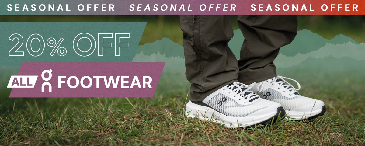 Seasonal offer banner showing a person in white athletic footwear standing on grass with a 20% discount message.