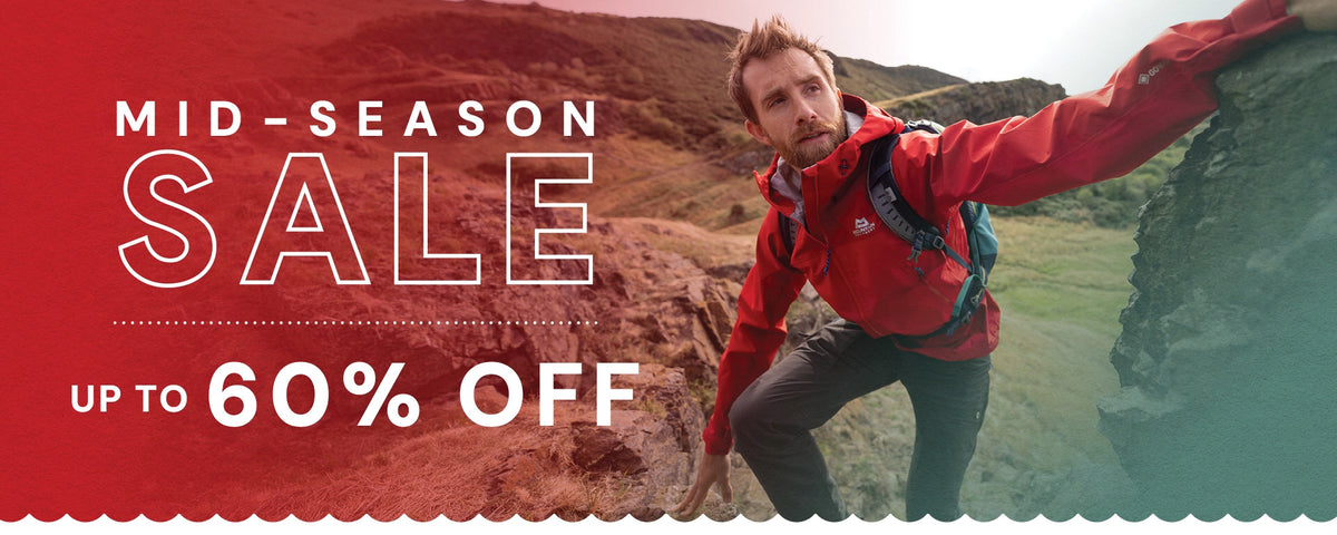 Mid-season sale banner featuring a hiker in a red outdoor jacket climbing rocky terrain, advertising up to 60% off outdoor clothing and gear.