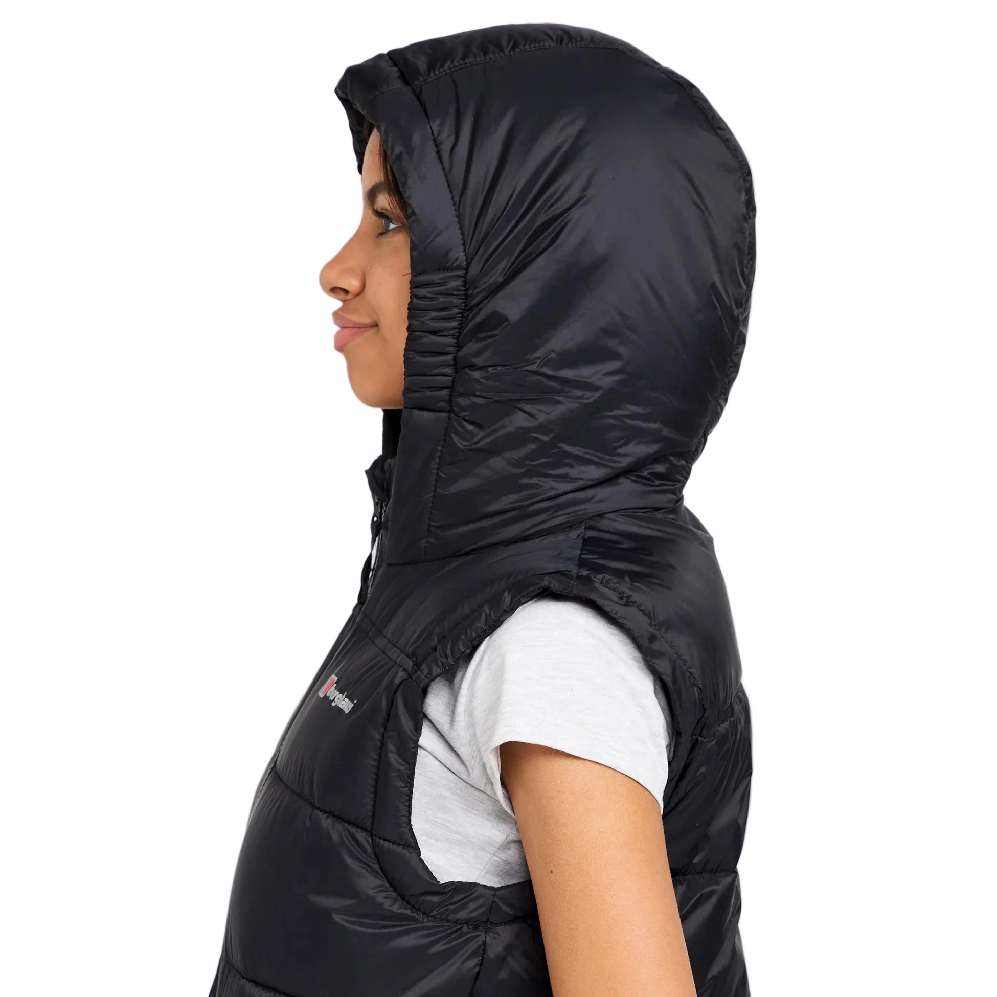 Person wearing a black hooded jacket on a white background