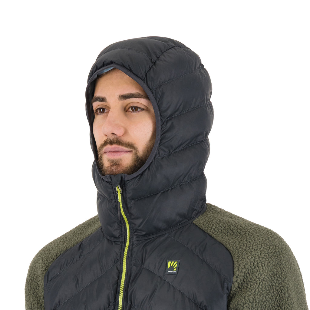 Close up of man wearing green and grey hooded jacket with the hood up