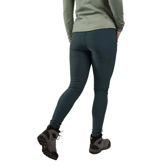 Person wearing teal leggings and hiking boots on a plain background