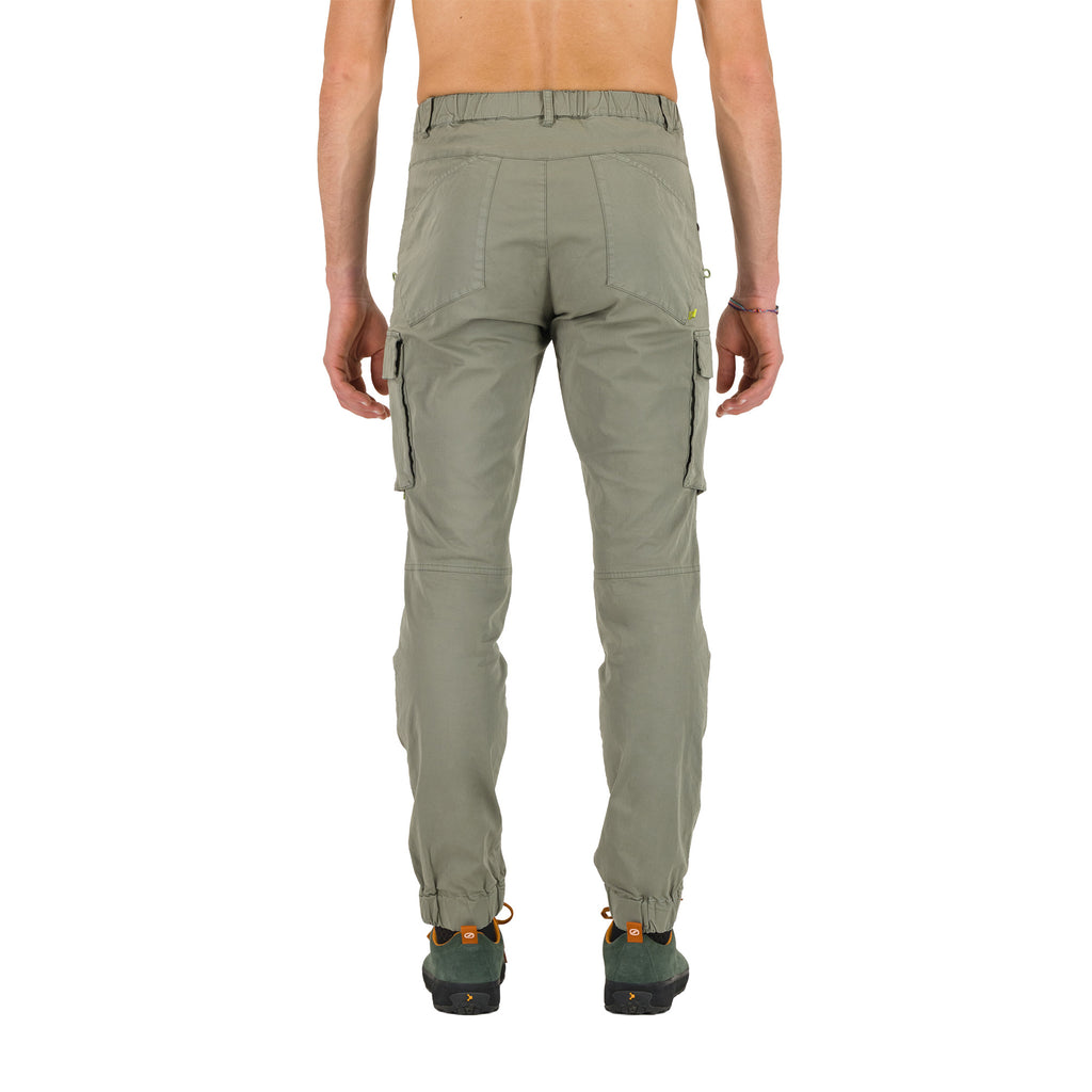 Back shot of a person wearing green cargo pants on a white background