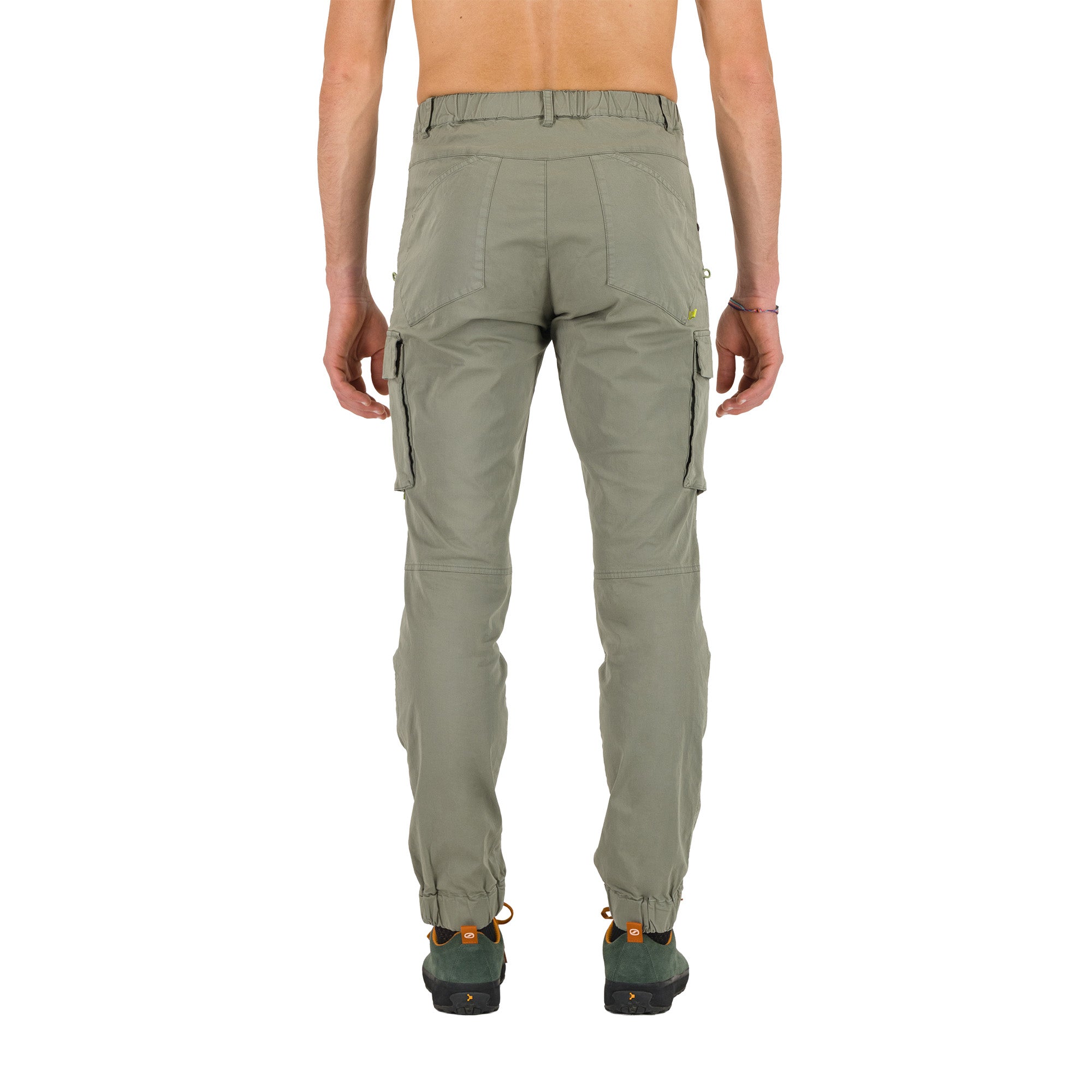 Back shot of a person wearing green cargo pants on a white background
