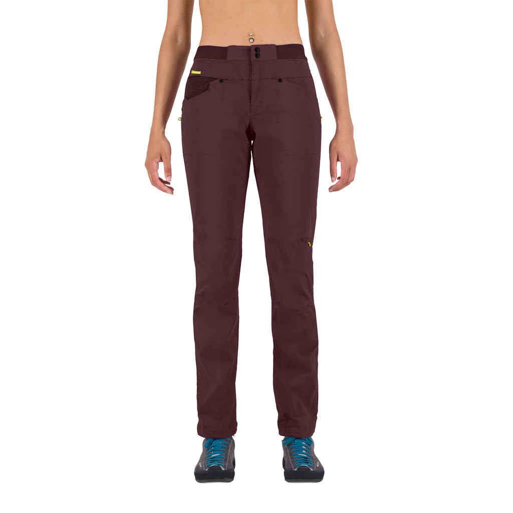 Maroon pants worn by a person on a white background