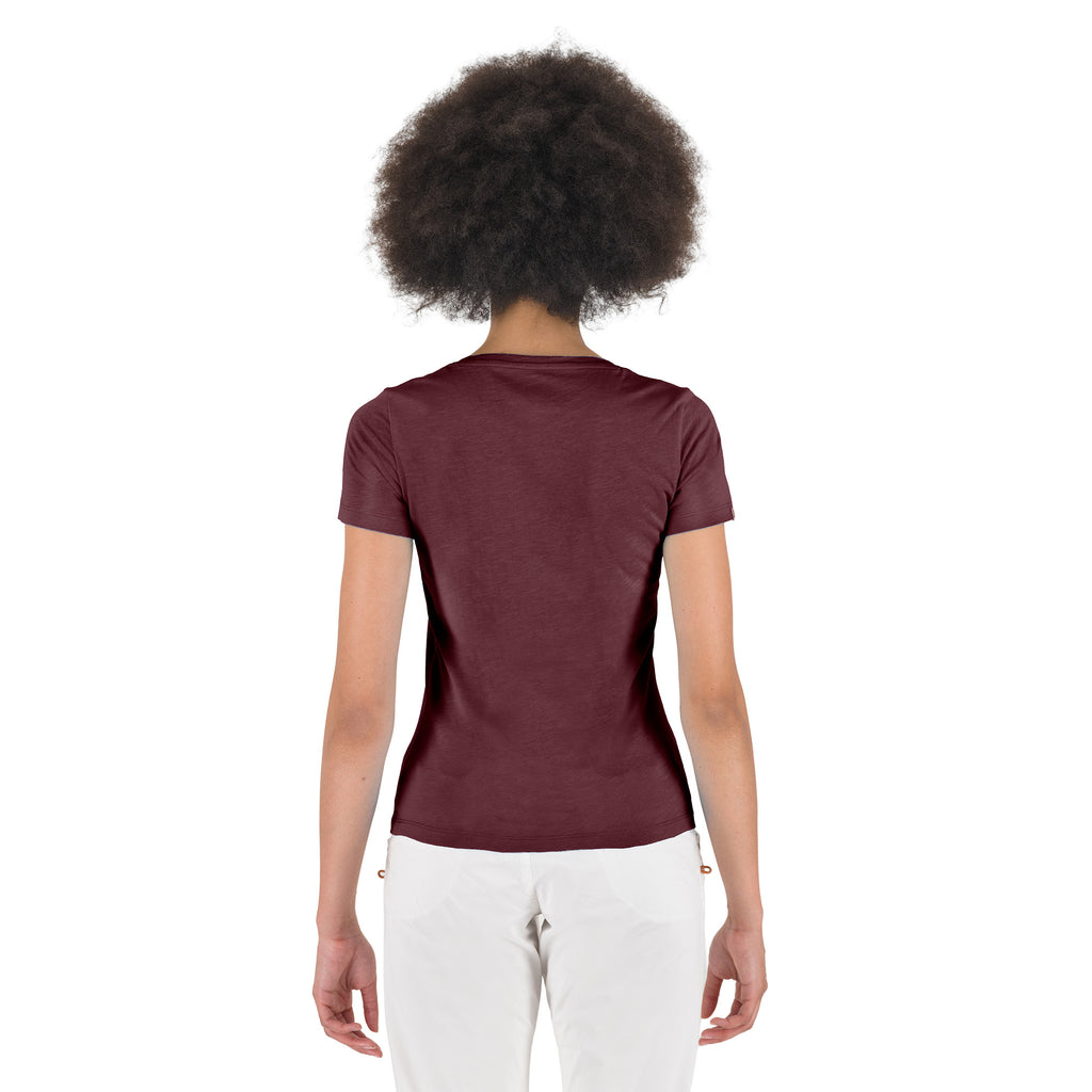 Person wearing a burgundy t-shirt on a white background