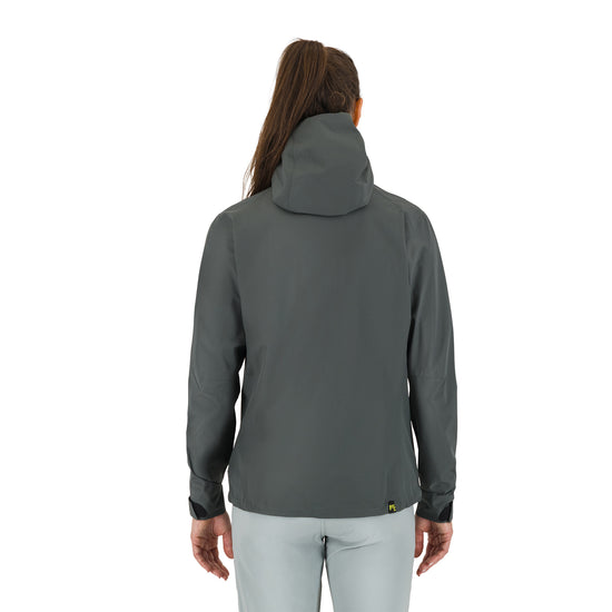 Person wearing a grey jacket on a white background