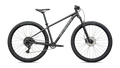 Side profile of a grey front suspension mountain bike on a white background 