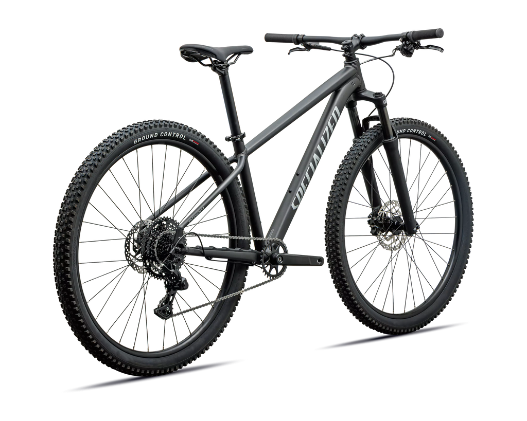 A matte black full-suspension mountain bike with knobby tires, a rear derailleur, and a visible 'Specialized' brand name on the frame, shown against a plain white background.
