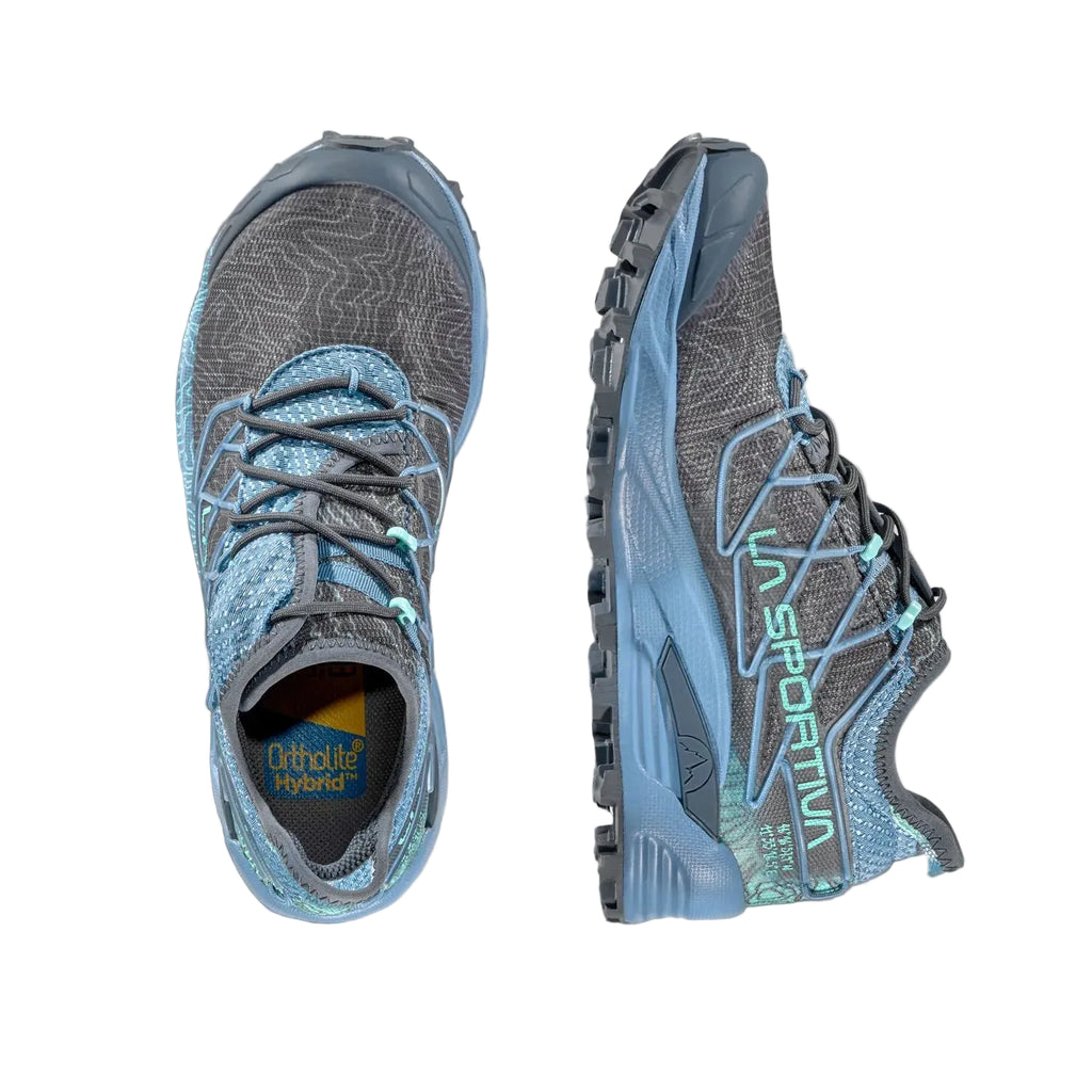 A pair of trail running shoes shown from the top and side views on a light gray background. The shoes feature a gray and blue patterned upper with a light blue midsole and black laces.