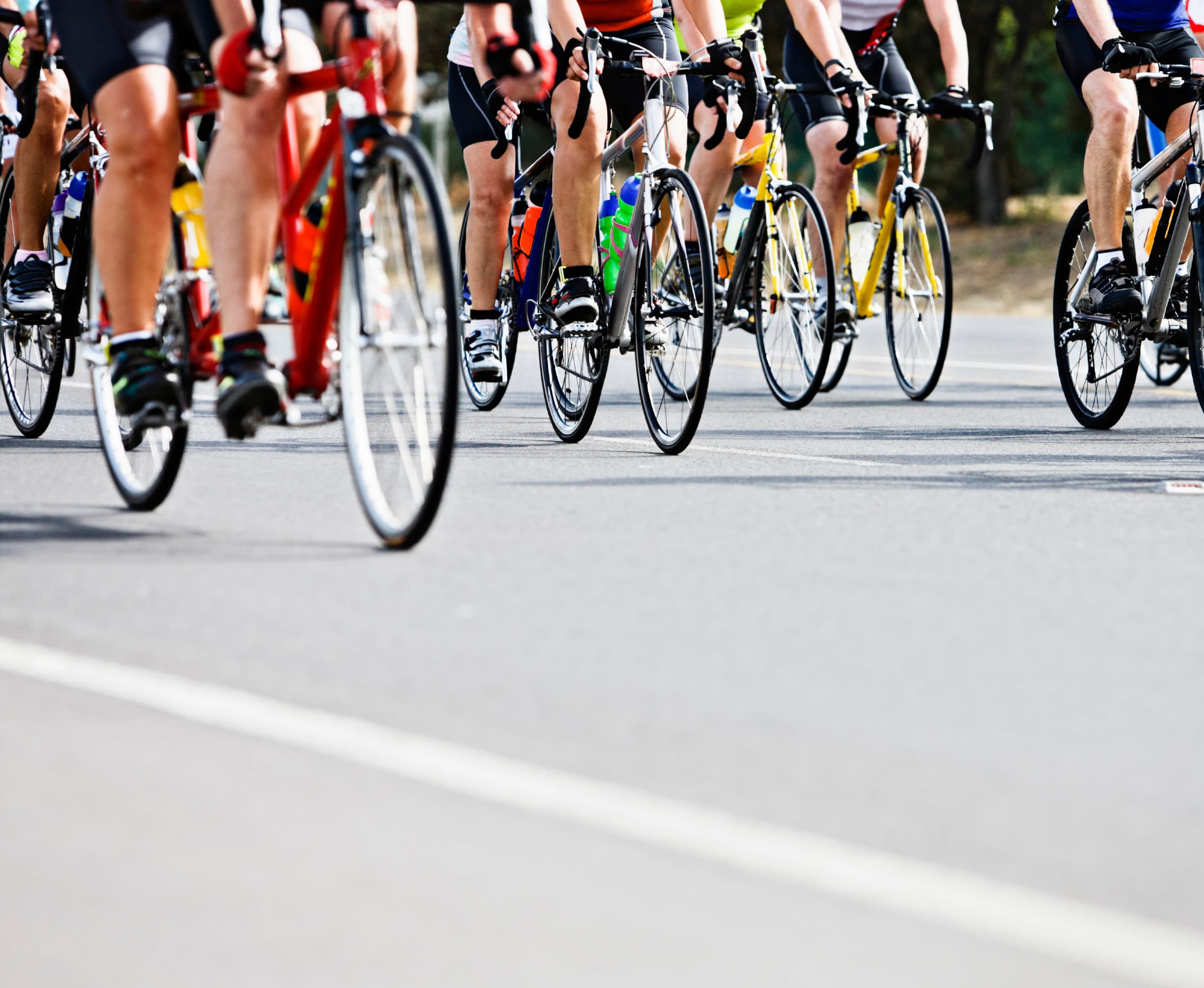 A cyclist crosses the finish line, celebrating
